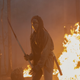 Michonne helps fight the fire by fighting zombies who are on fire.